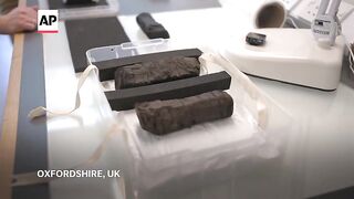 Scientists try to decipher ancient scrolls charred by Vesuvius volcano.mp4