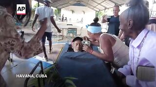 Cubans celebrate life and death with a mock funeral.mp4