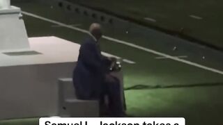 Samuel L. Jackson checking his phone during a break in his _SuperBowl Halftime Show cameo is a mood(