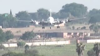 DC-6 Plane Landing on crop field