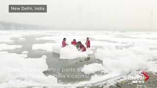 Clouds of toxic foam float on surface of India's sacred Yamuna river.