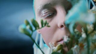 woman smelling flowers