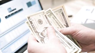 Closeup video of man counting his money