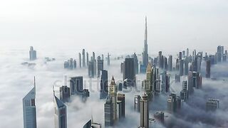 Amazing aerial shot of Cayan Tower & skyscrapers in Dubai Marina